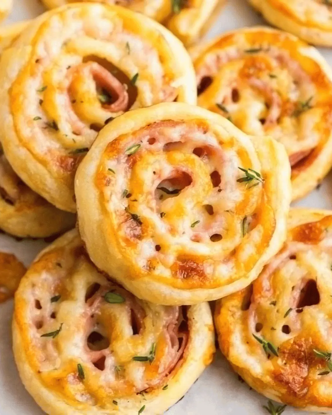 Savory Puff Pastry with Ham and Cheese topped with creamy Béchamel sauce.